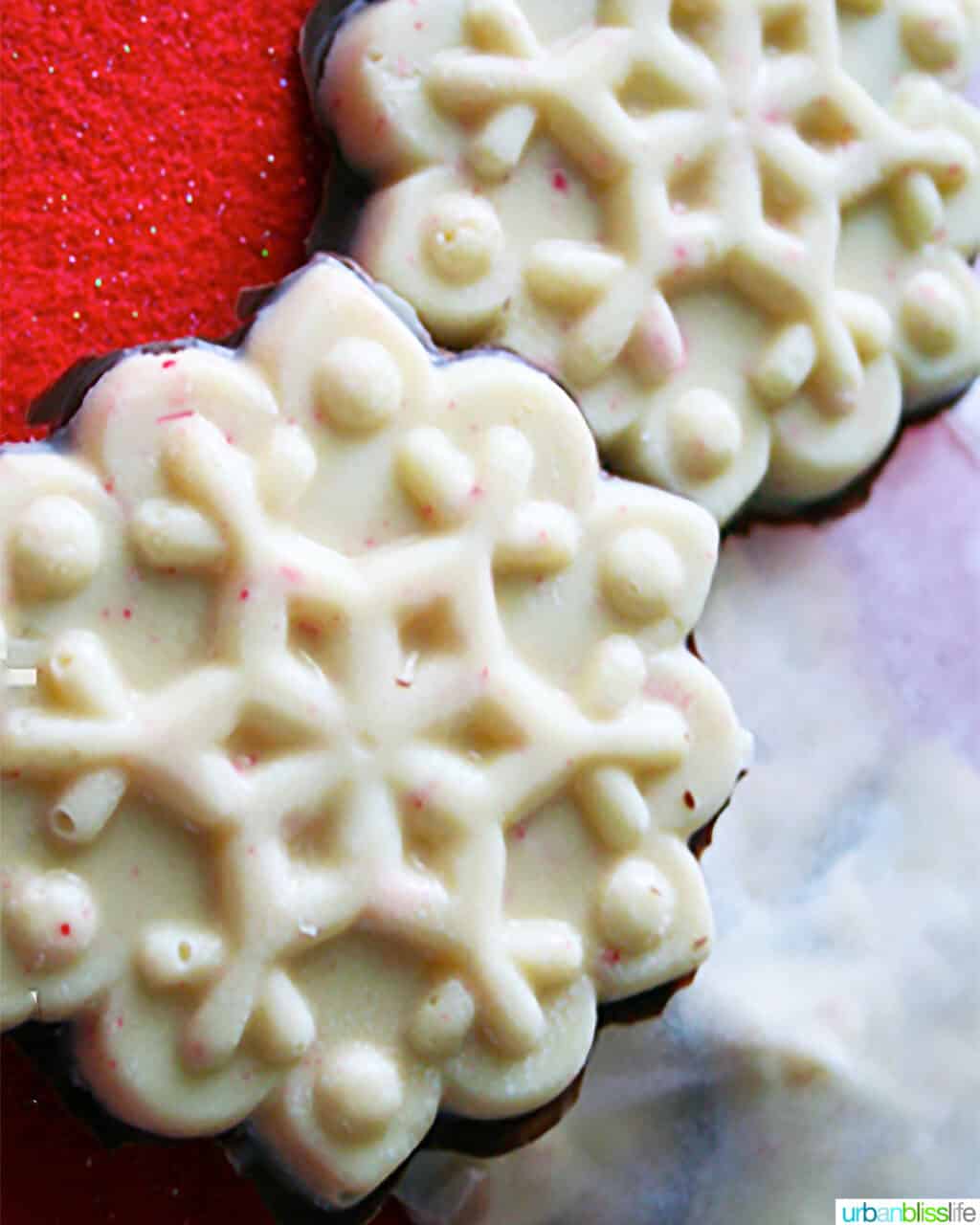 two white chocolate holiday bark in snowflake shapes.