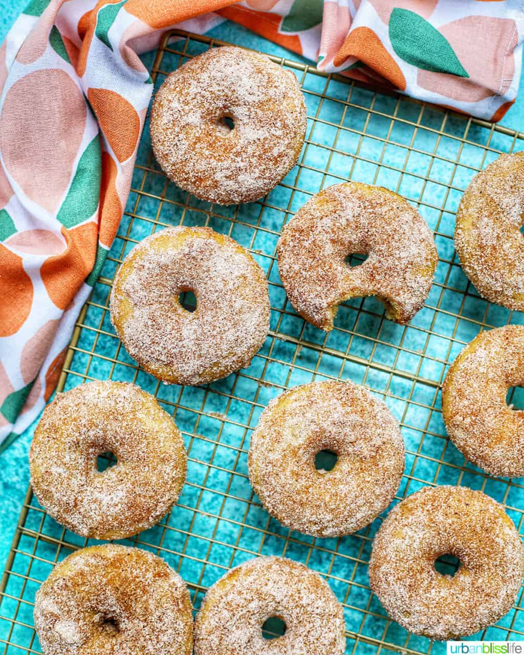 cooling rack of apple cinnamon donuts