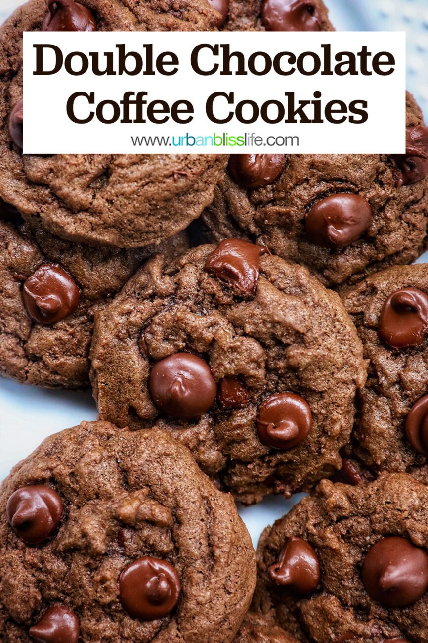 several double chocolate coffee cookies layered on a white plate.