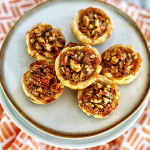 mini pecan pies centered on a plate