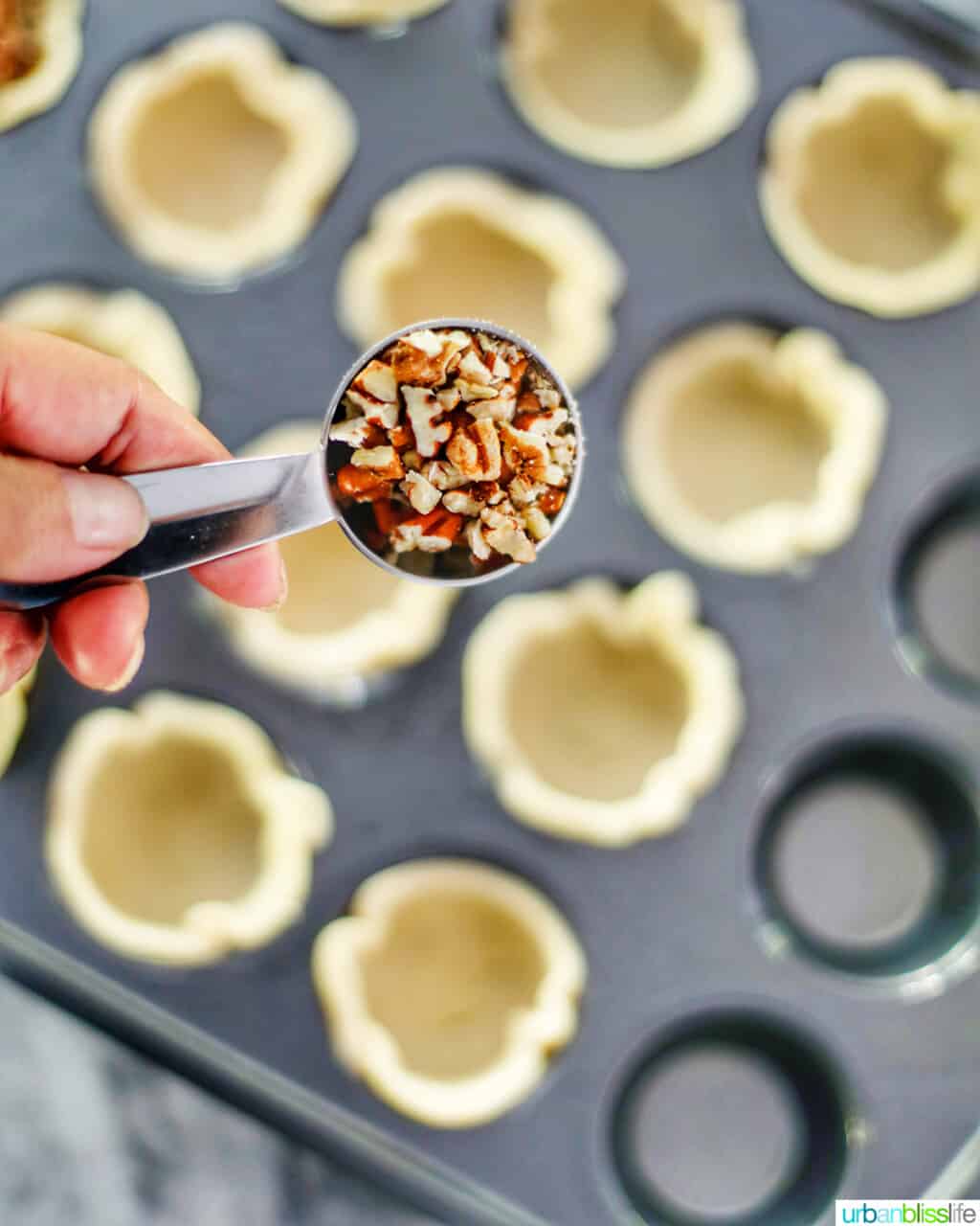 adding pecans into dough