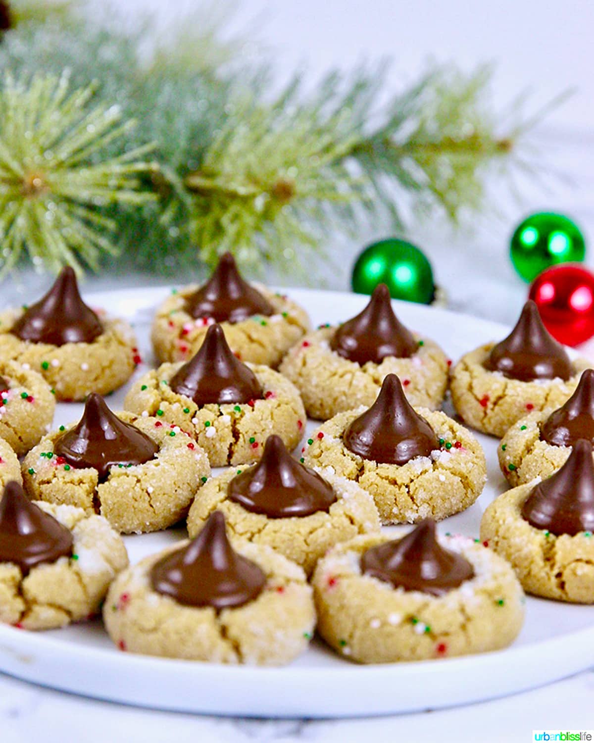 Peanut Butter Blossom Cookies with a holiday background