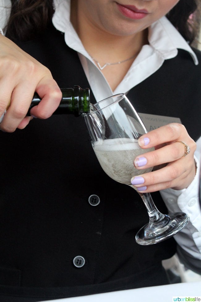 server pouring champagne