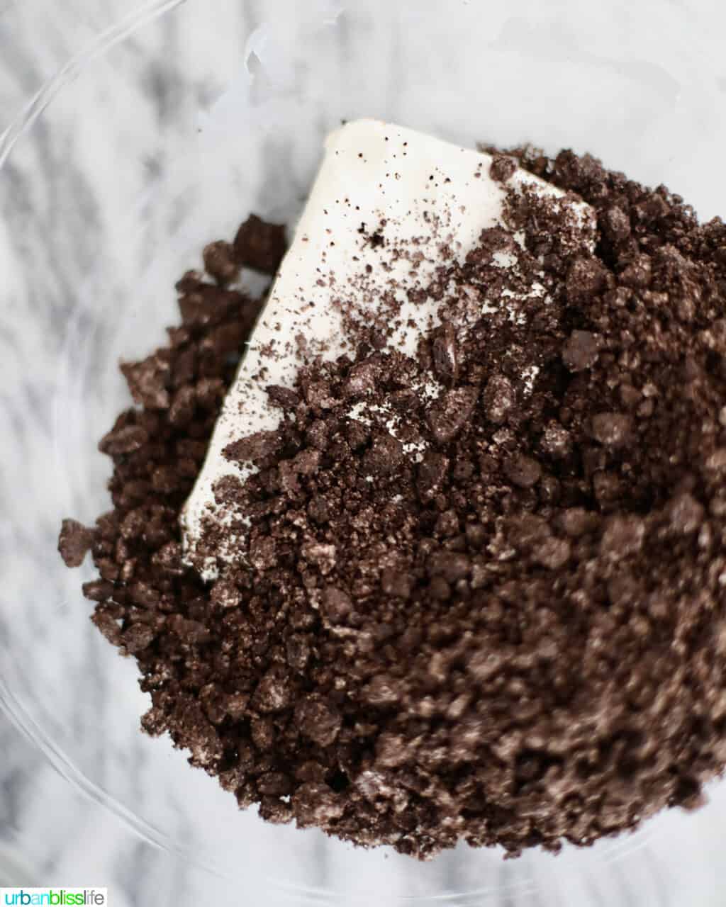 mixing together cream cheese and Oreo cookies for truffles