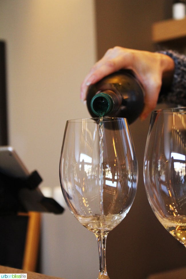 white wine being poured into glass
