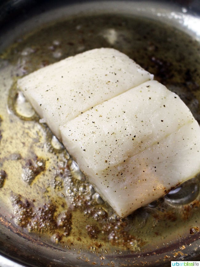 Wild Alaskan Halibut Poached with Tomatoes and Peas Wine Sauce, recipe on UrbanBlissLife.com