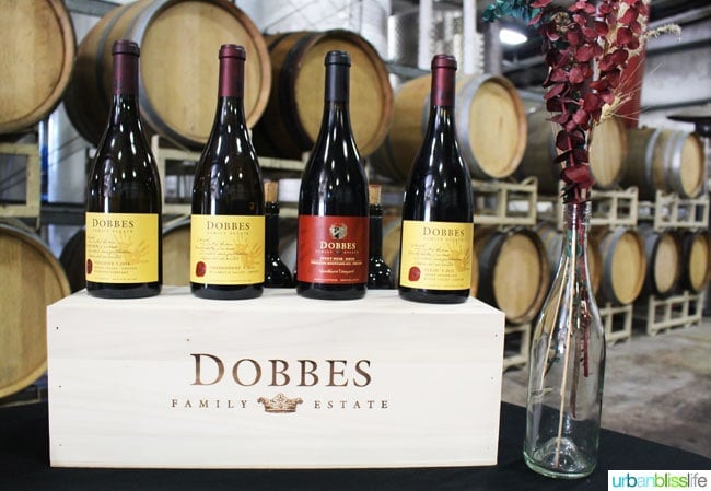 Dobbes WInery wine bottles in barrel room