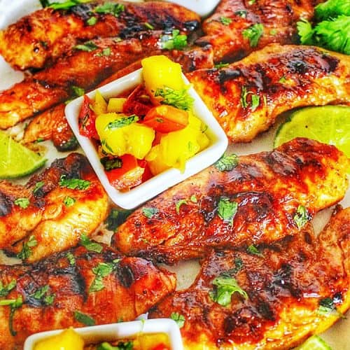 closeup of Grilled Pineapple Chicken with Pineapple Mango Salsa in little cups