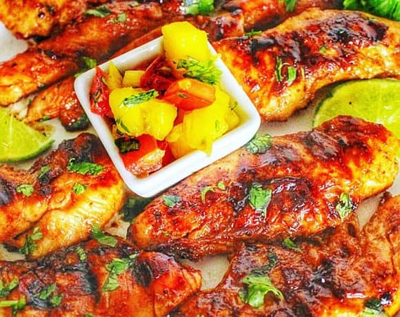 closeup of Grilled Pineapple Chicken with Pineapple Mango Salsa in little cups