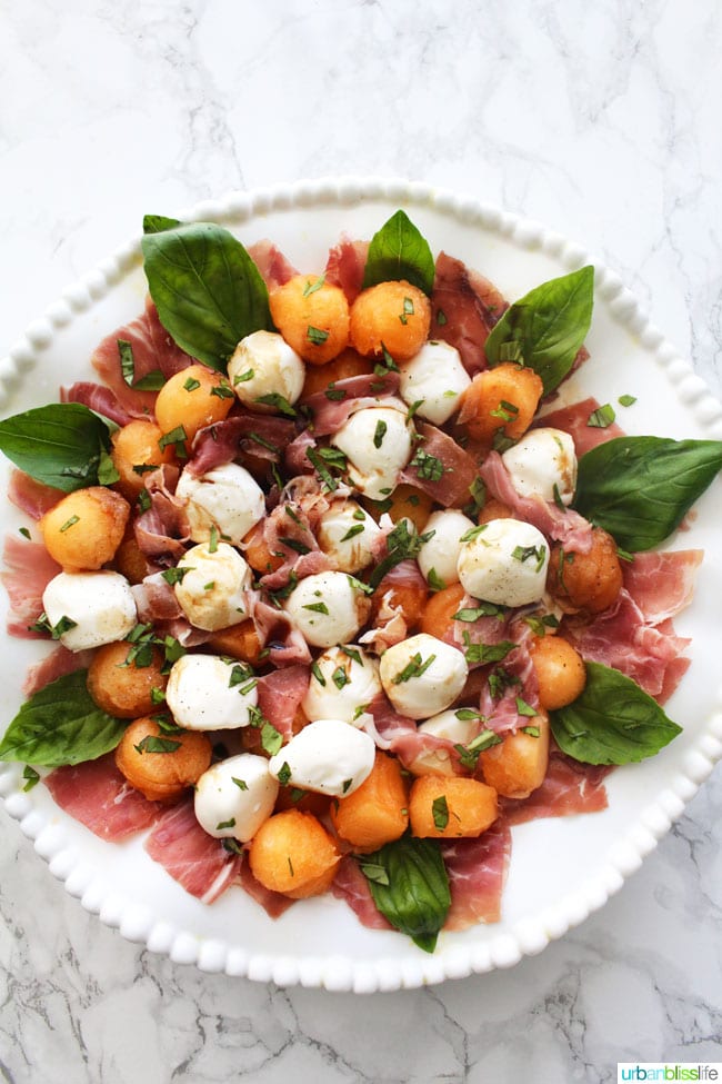 Summer Melon & Prosciutto Caprese Salad is perfect for barbecues and picnics! Recipe on UrbanBlissLife.com