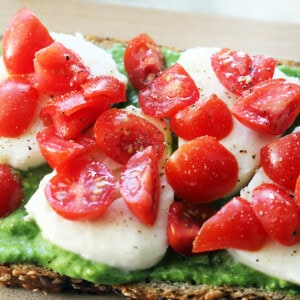 caprese tartines with avocado pesto spread