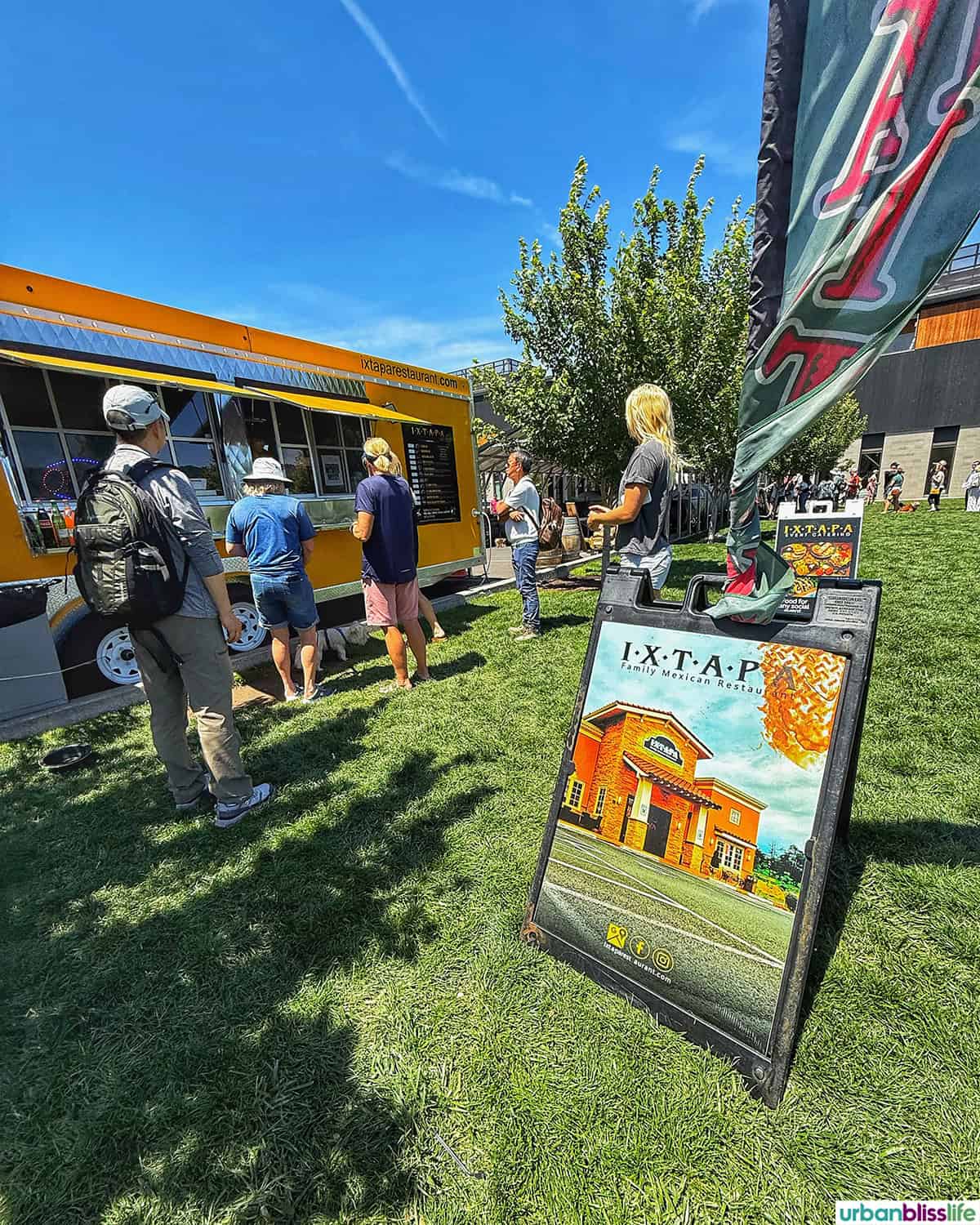 outdoor food trucks and lines at the Hood River waterfront.