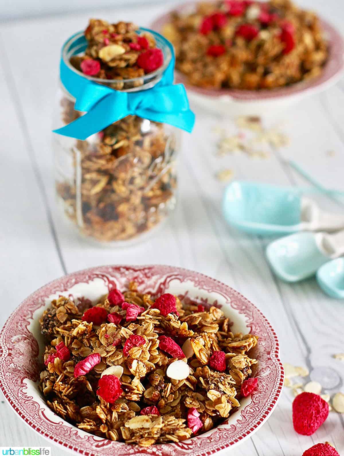 bowl of honey almond granola and mason jar with homemade granola.