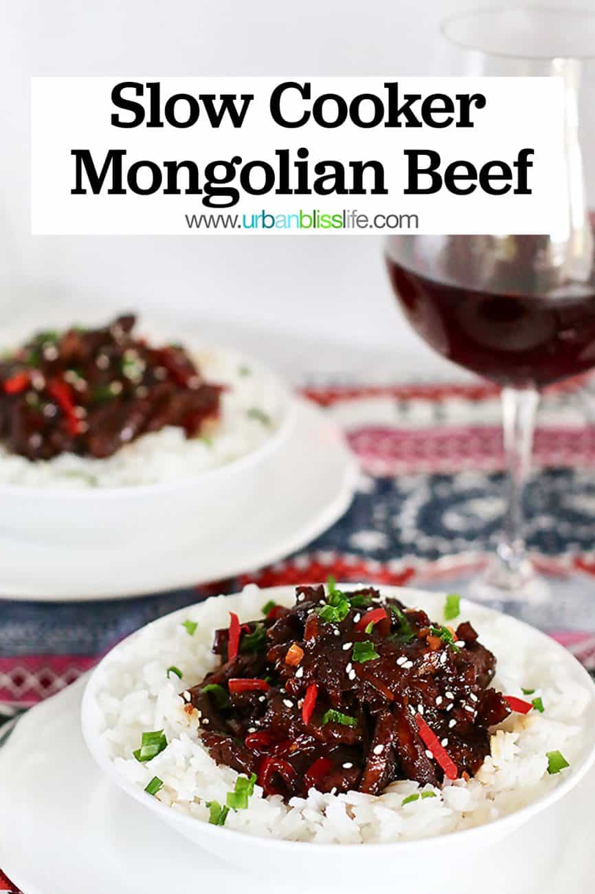 two bowls of Slow Cooker Mongolian Beef and glass of red wine