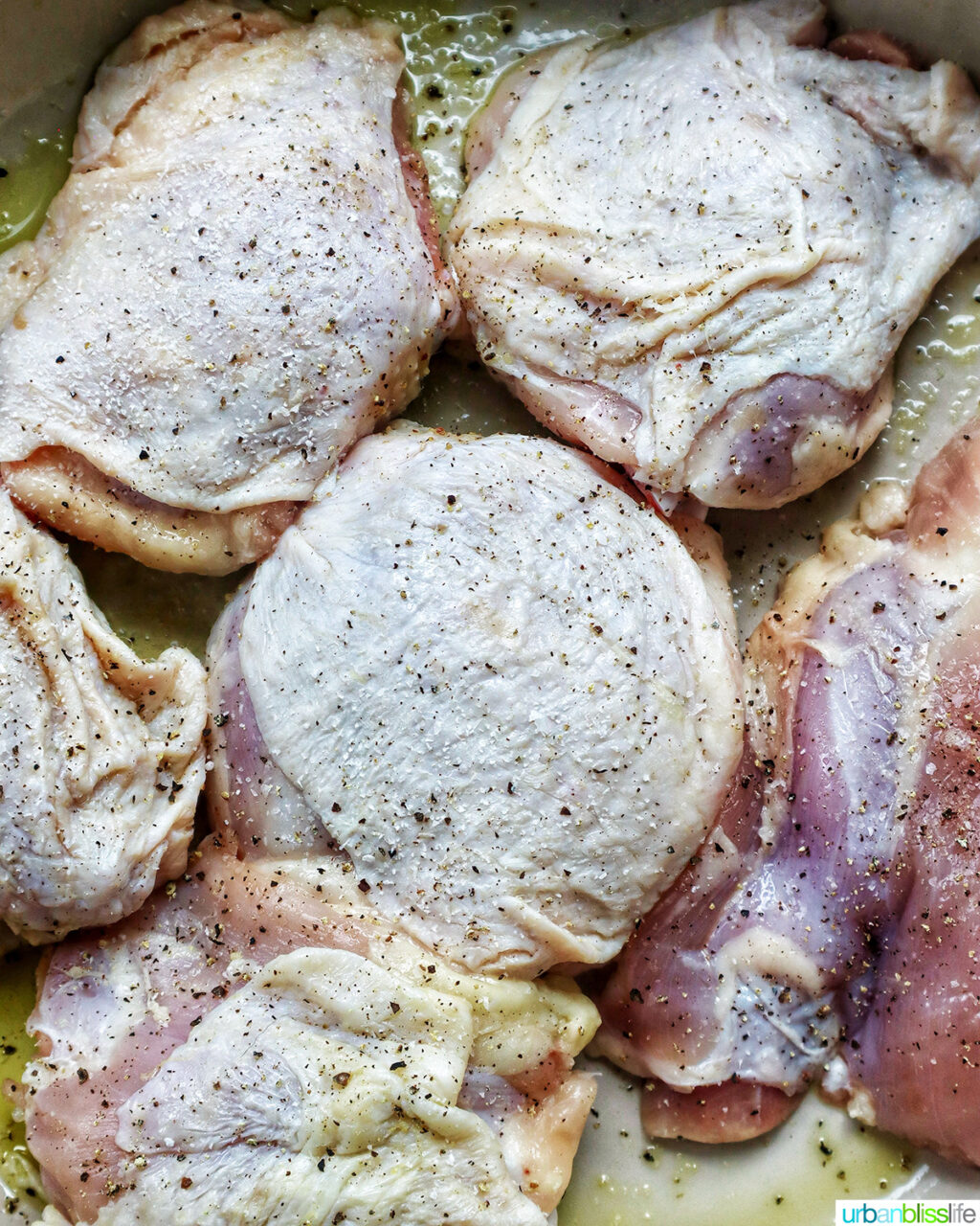 chicken thighs in a pan.
