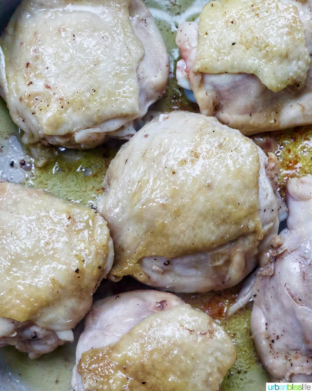 chicken thighs in a pan.