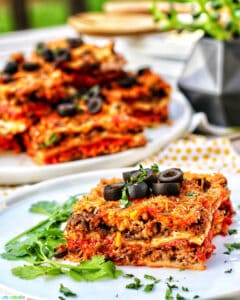 Mexican lasagna slice with more slices in the background
