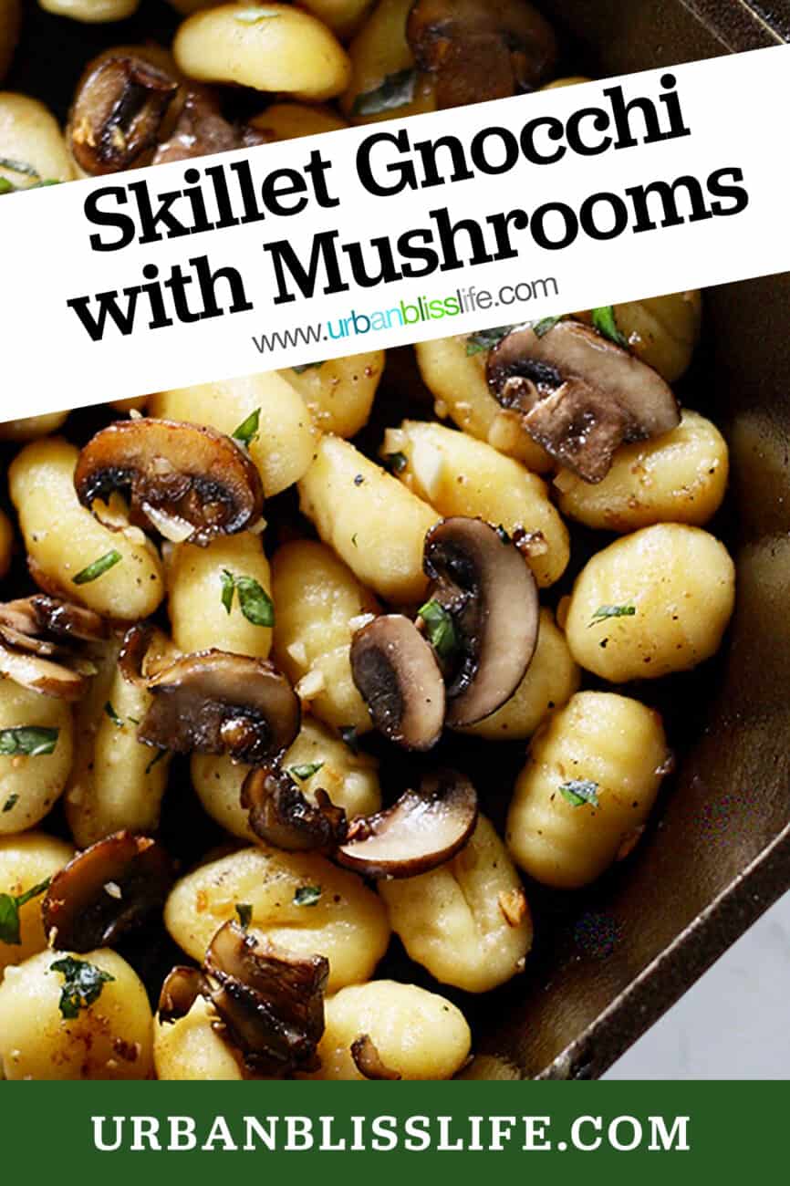 cast iron skillet with gnocchi, mushrooms, basil and title text.