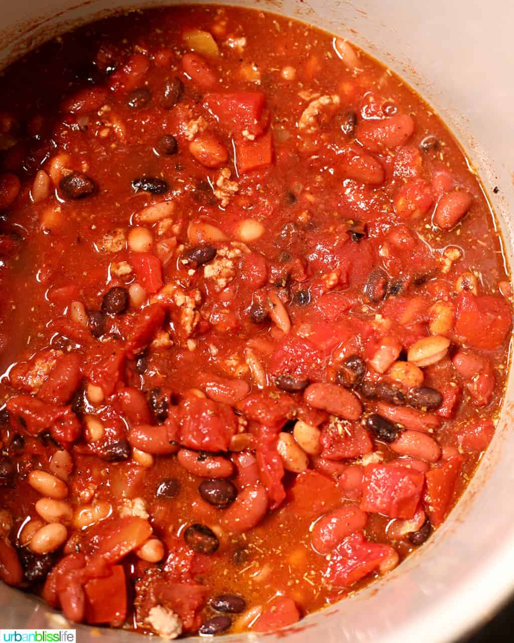 stirred ingredients for chili in pressure cooker