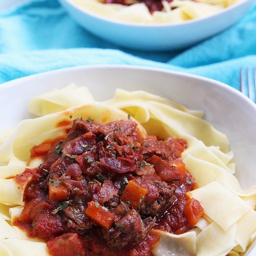 big bowls of Instant Pot Short Rib Ragu over pasta