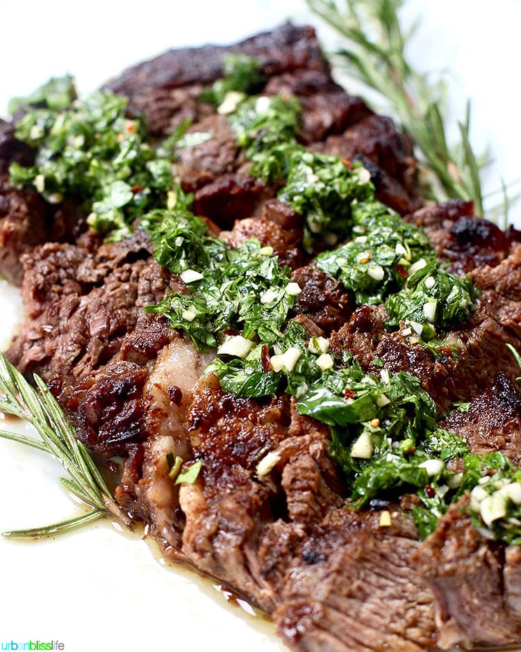 Cast iron rib eye steak with chimichurri sauce.