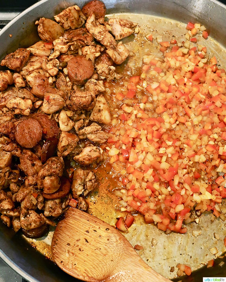 cooking seafood paella in a paella pan