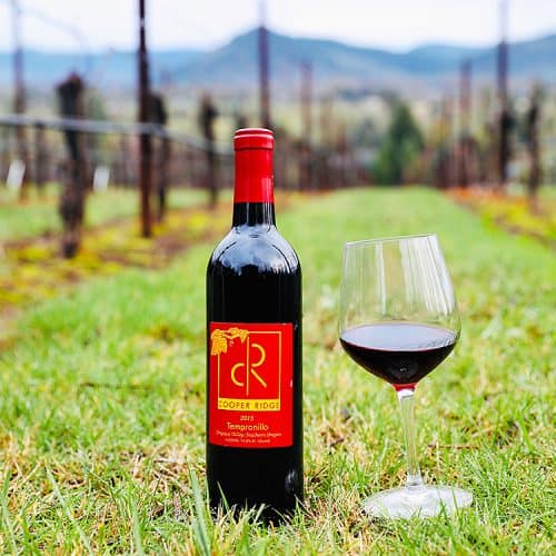 wine bottle and red wine glass at Roseburg wineries