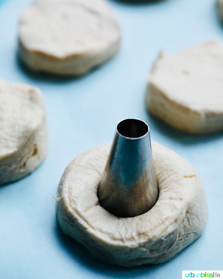 cutting doughnut holes in dough for air fryer donuts