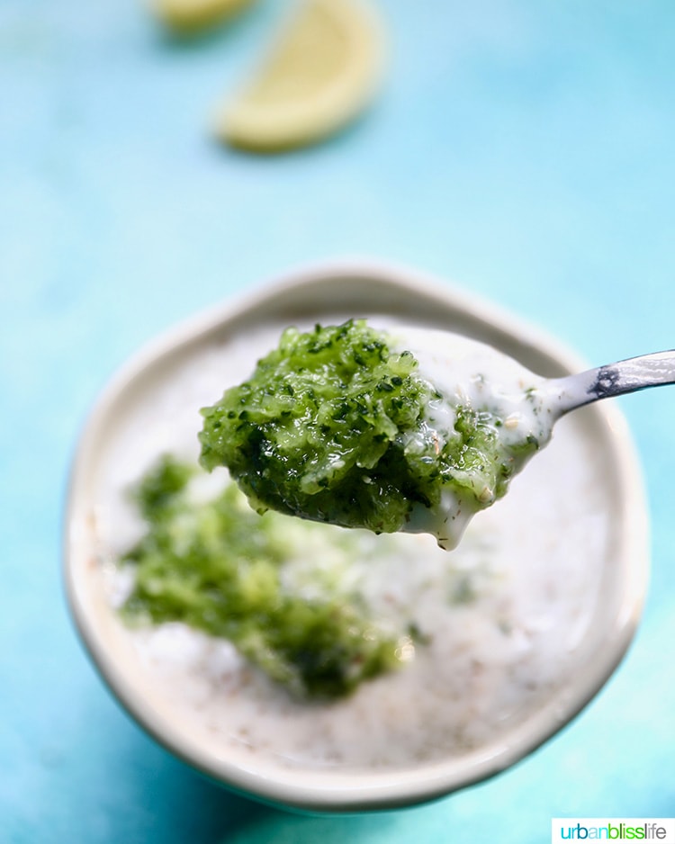 grated cucumbers going into vegan tzatziki