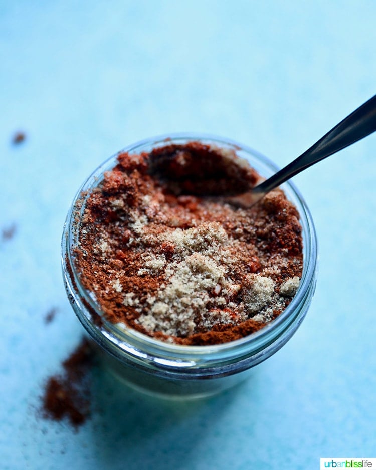 mixing ingredients for jar of homemade bbq seasoning recipe