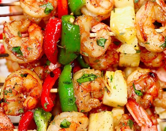 closeup of several grilled shrimp pineapple skewers served together