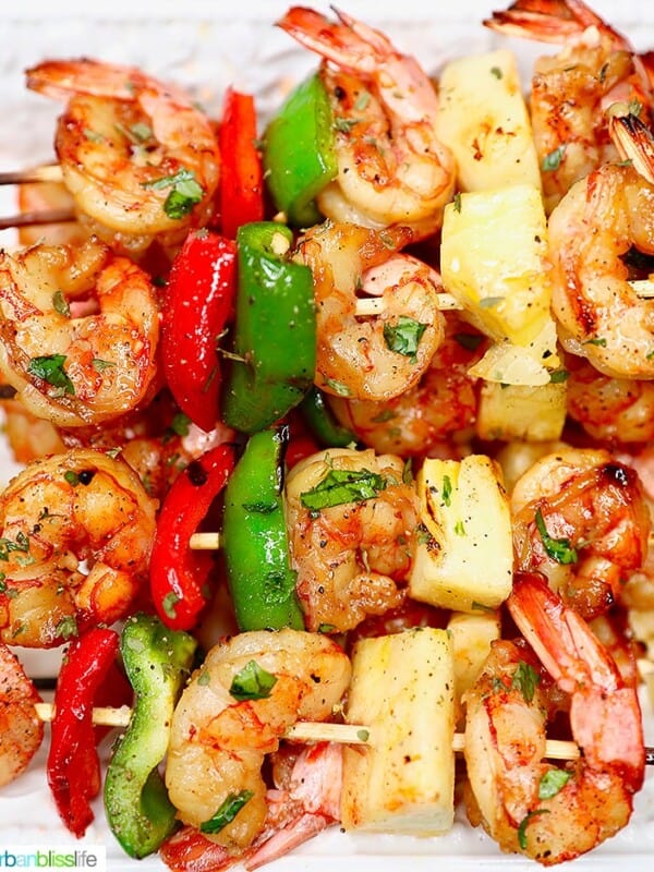 closeup of several grilled shrimp pineapple skewers served together
