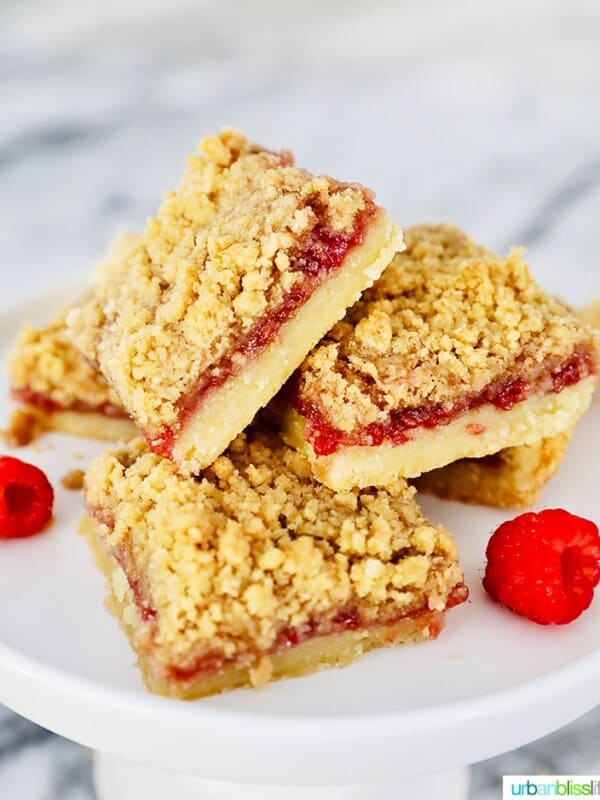 stack of Raspberry Crumble Bars on pedestal