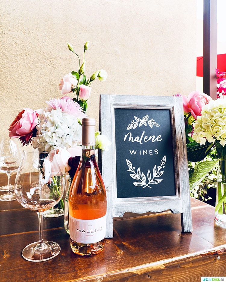 Malene Rosé bottle with flowers and wine glass