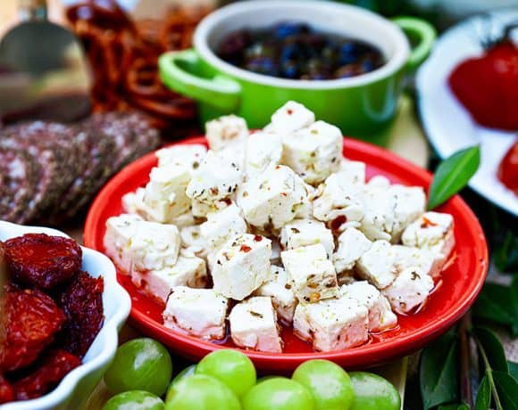 marinated feta as part of a spread with grapes