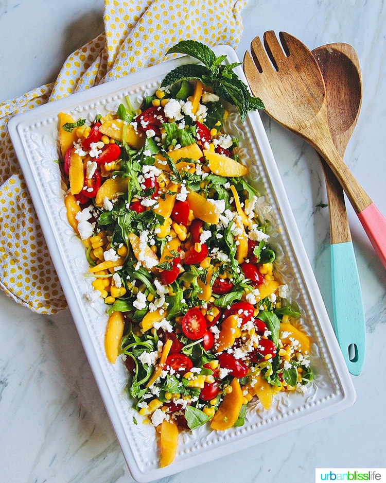peach tomato salad on a platter