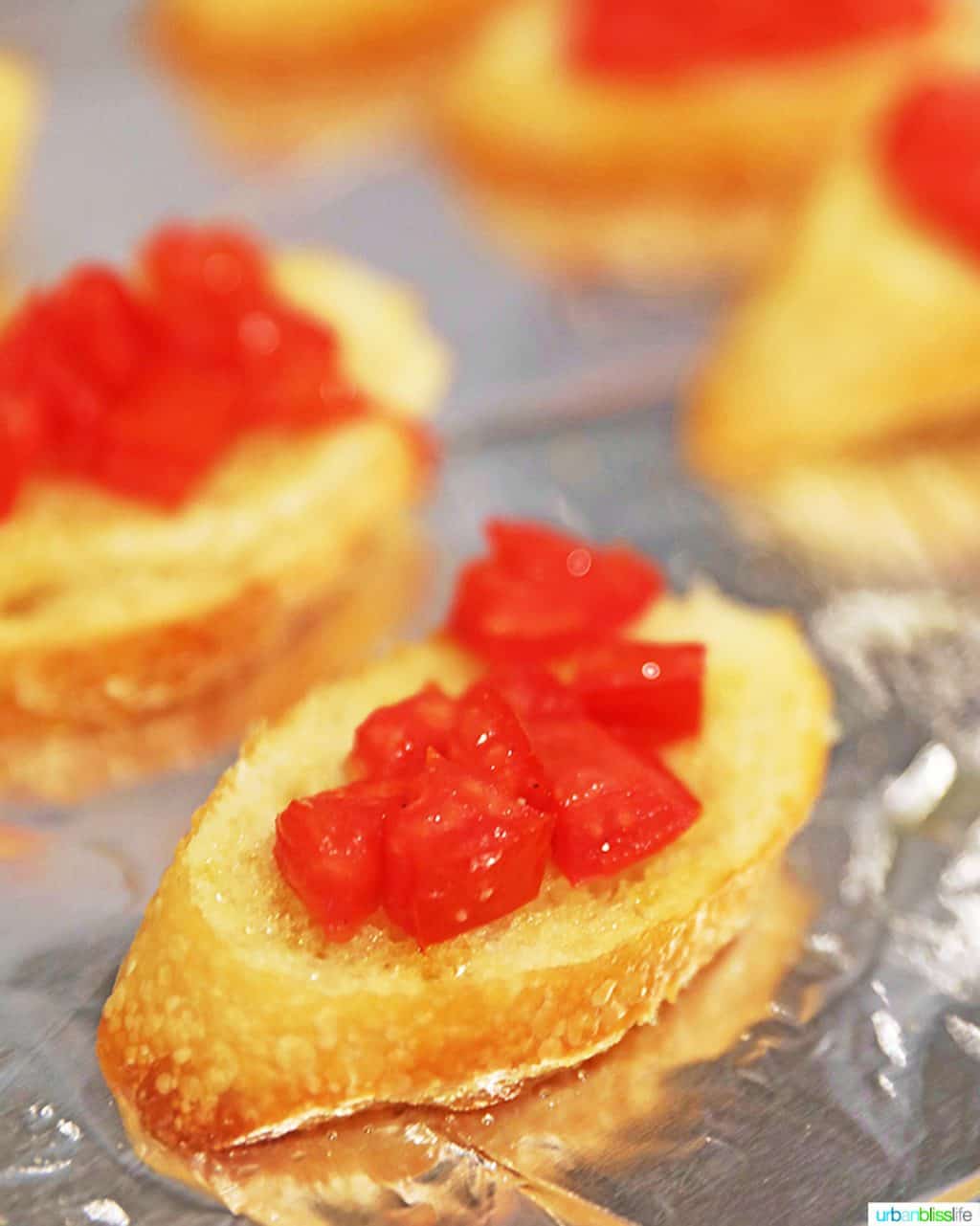 tomatoes on top of baguette slices