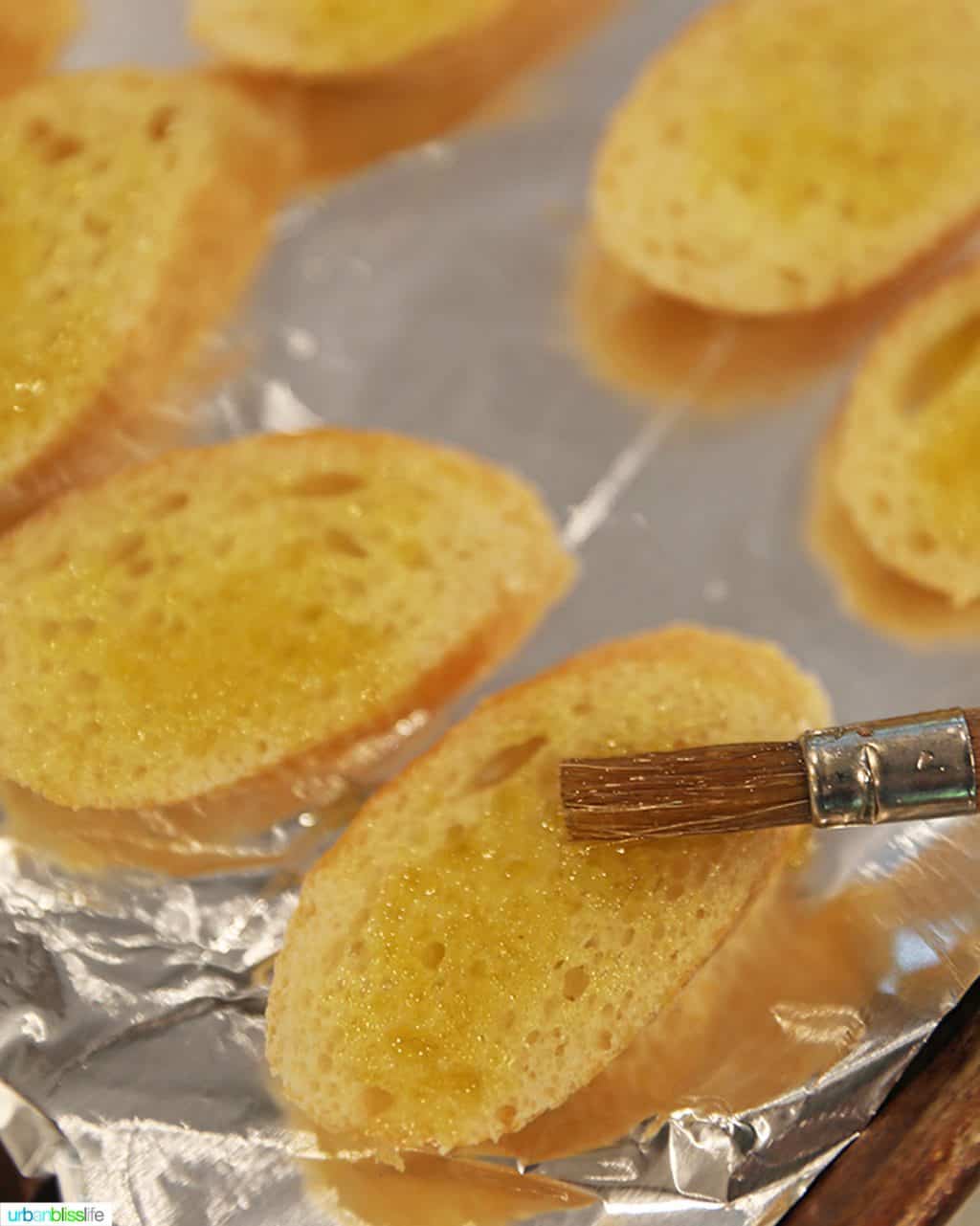 brushing bruschetta with olive oil