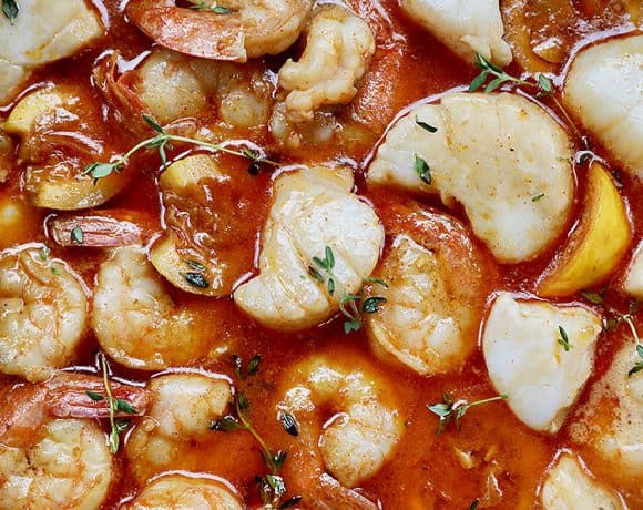 closeup of New Orleans-style BBQ shrimp and scallops