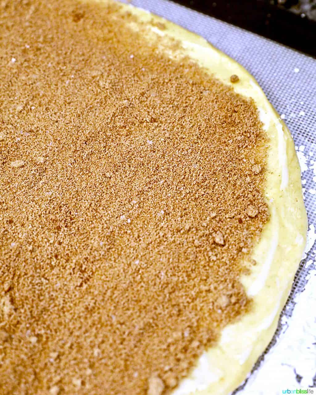 filling on dough for orange cinnamon rolls