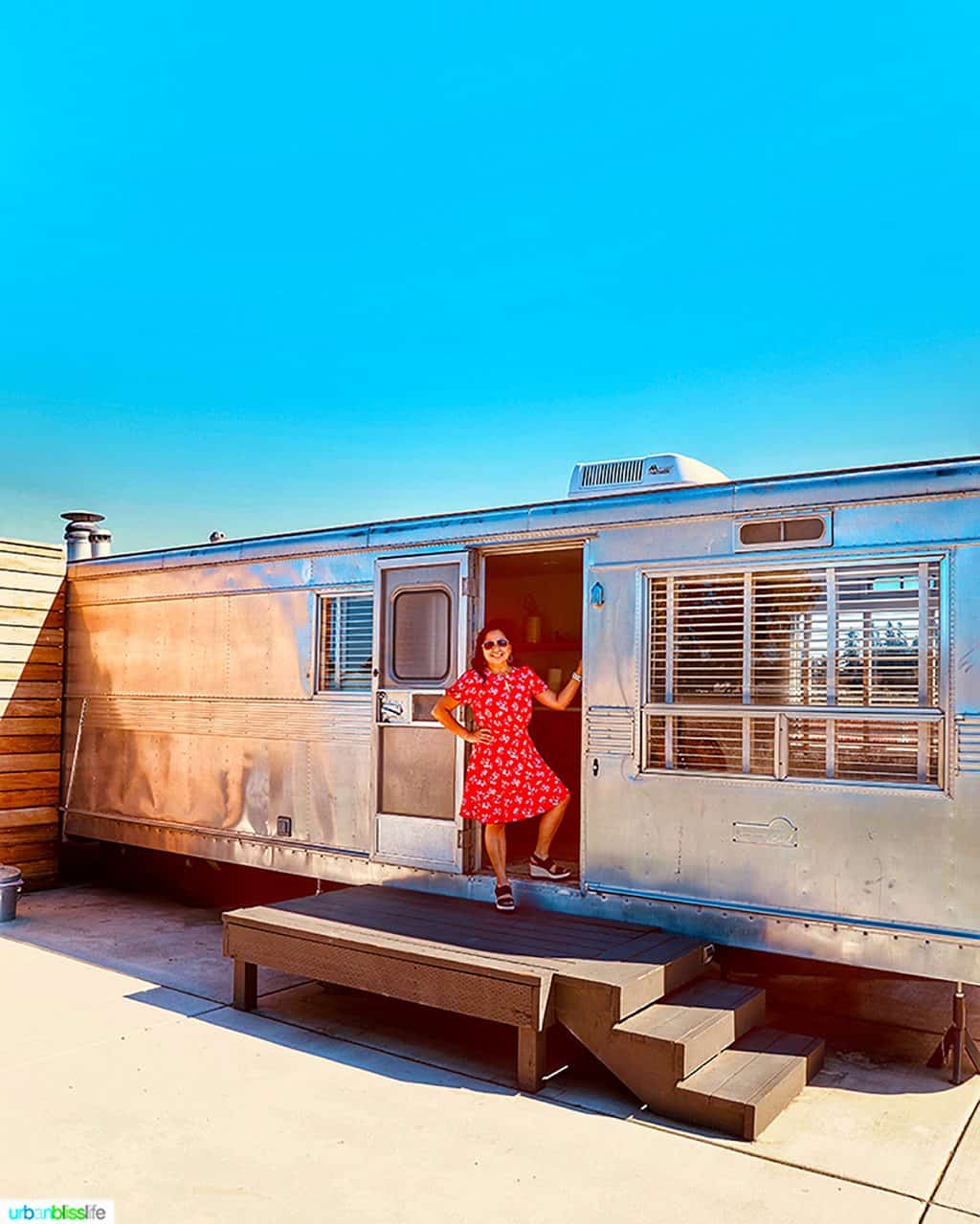 Marlynn Schotland in doorway of the mansion airstream at Vintages Trailer Resort