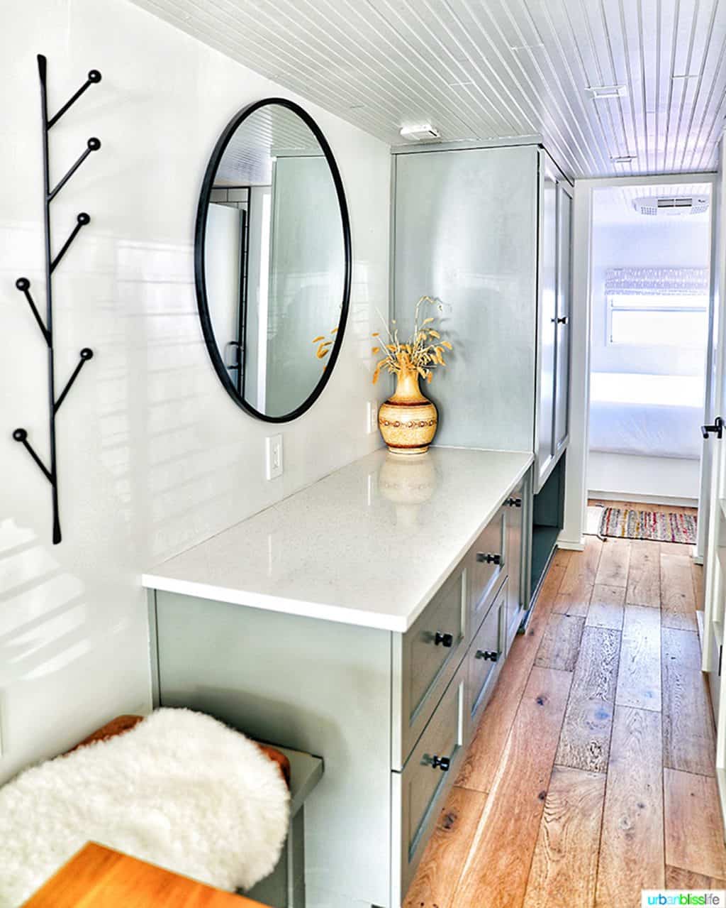 bright white and grey hallway with drawers in mansion airstream