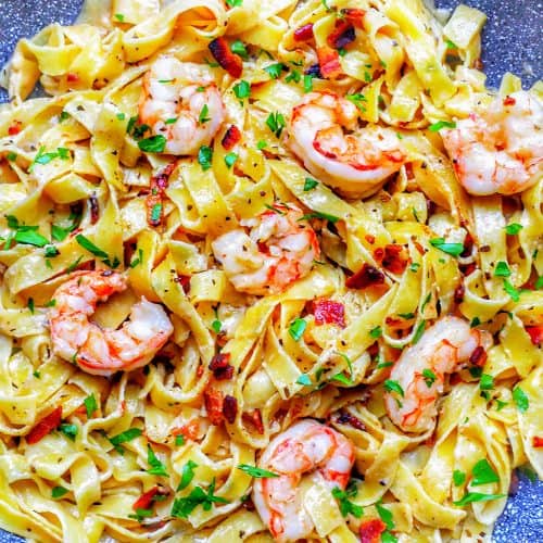 full photo of bacon shrimp pasta in pan
