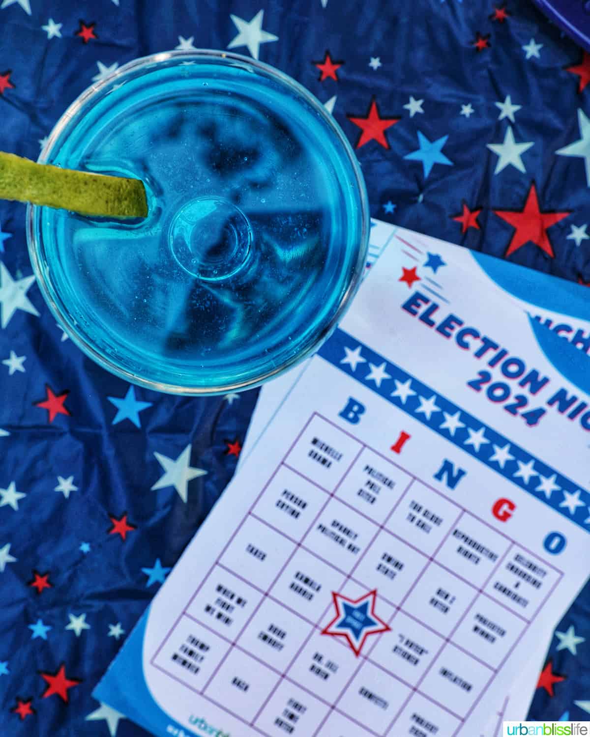 blue wave cocktail next to election night bingo cards.