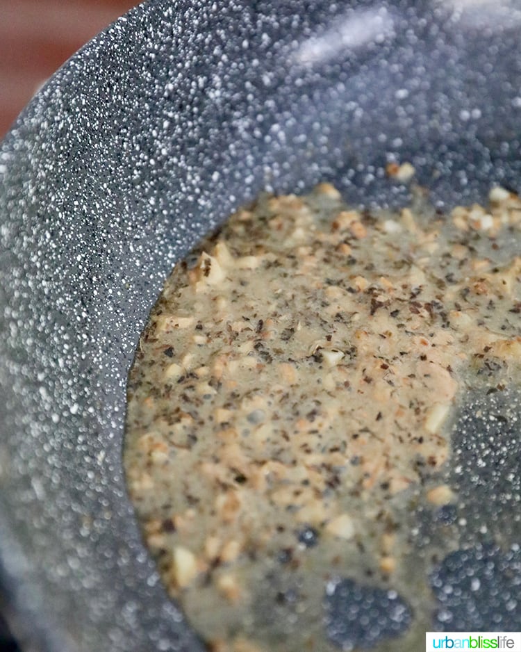 garlic and herbs in pan