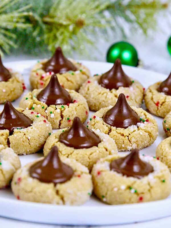 peanut butter blossom cookies with a Christmas background