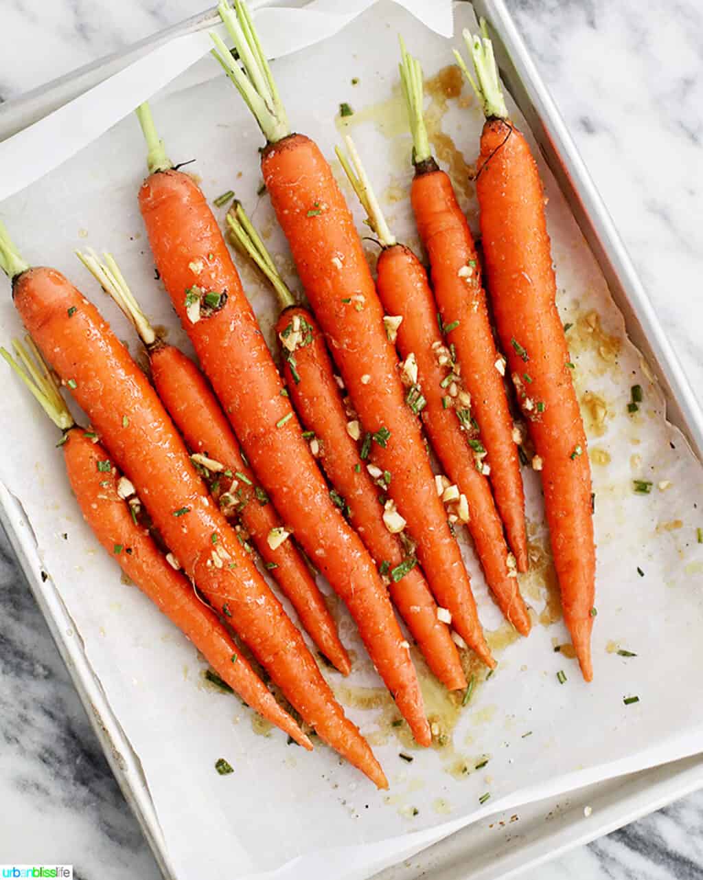 plate of garlic rosemary roasted glazed carrots before cooking