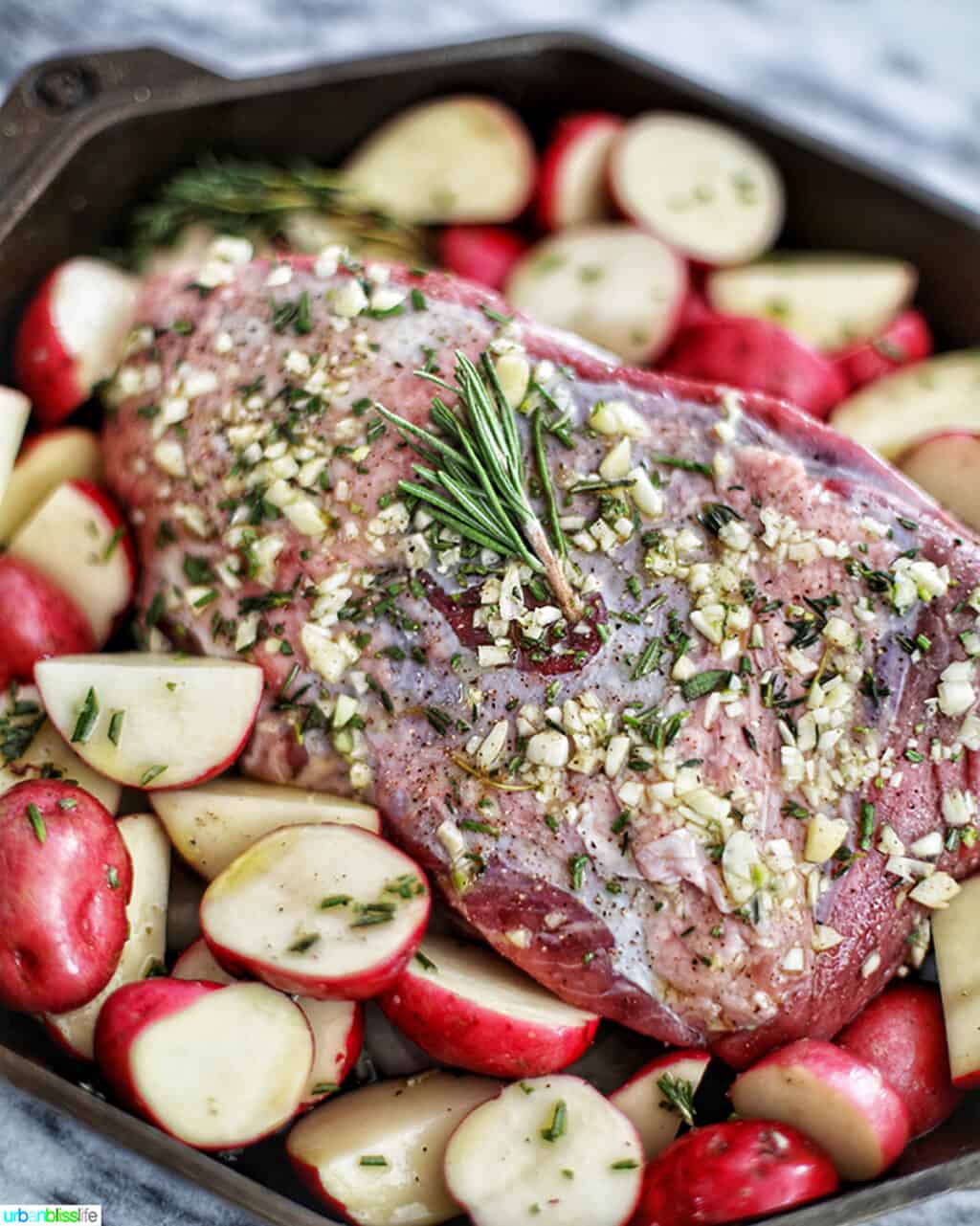 Garlic Rosemary Sirloin Tip Roast with potatoes in Finex cast iron skillet
