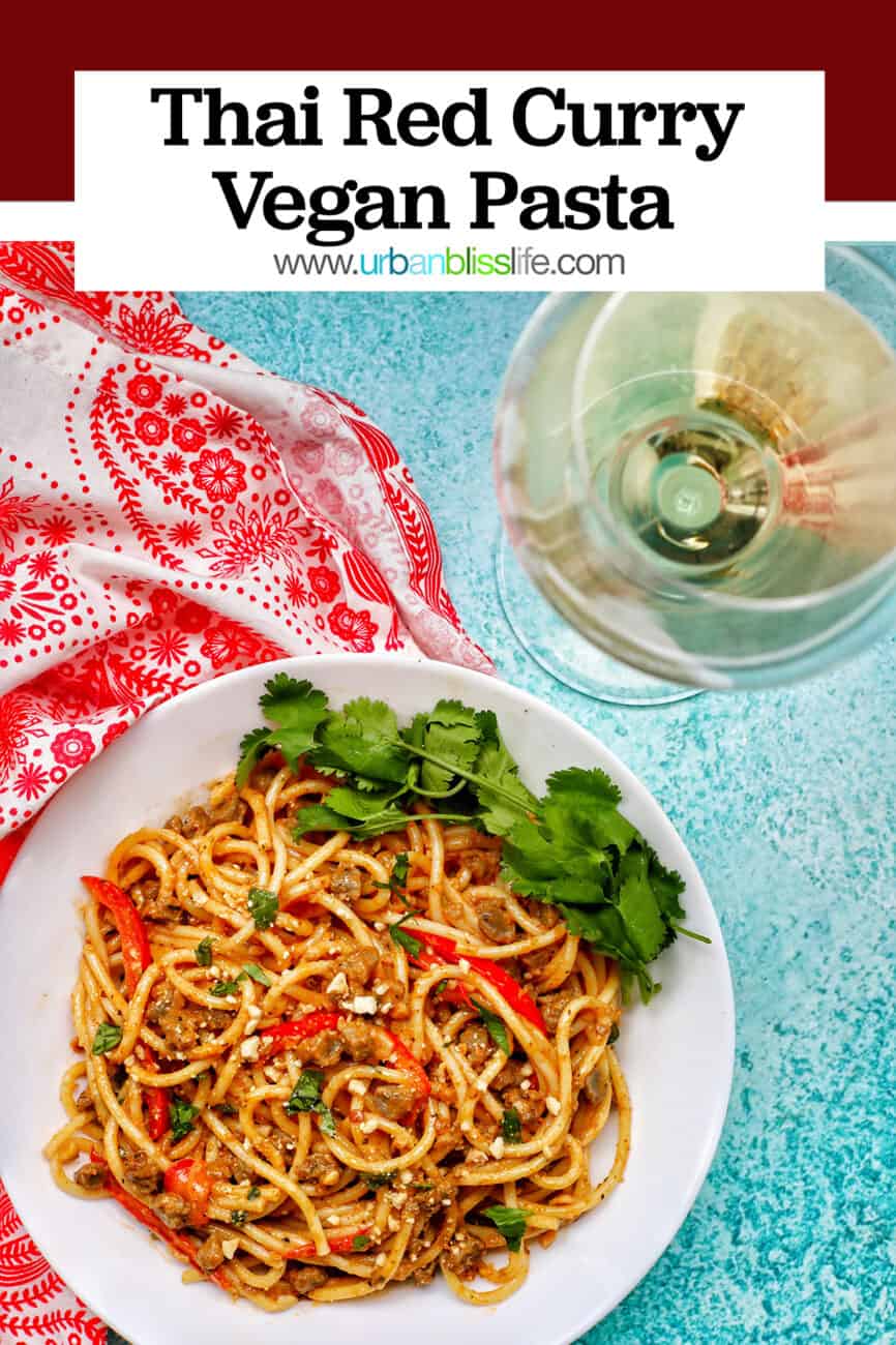 bowl of Thai Red Curry Pasta with glass of white wine and title text