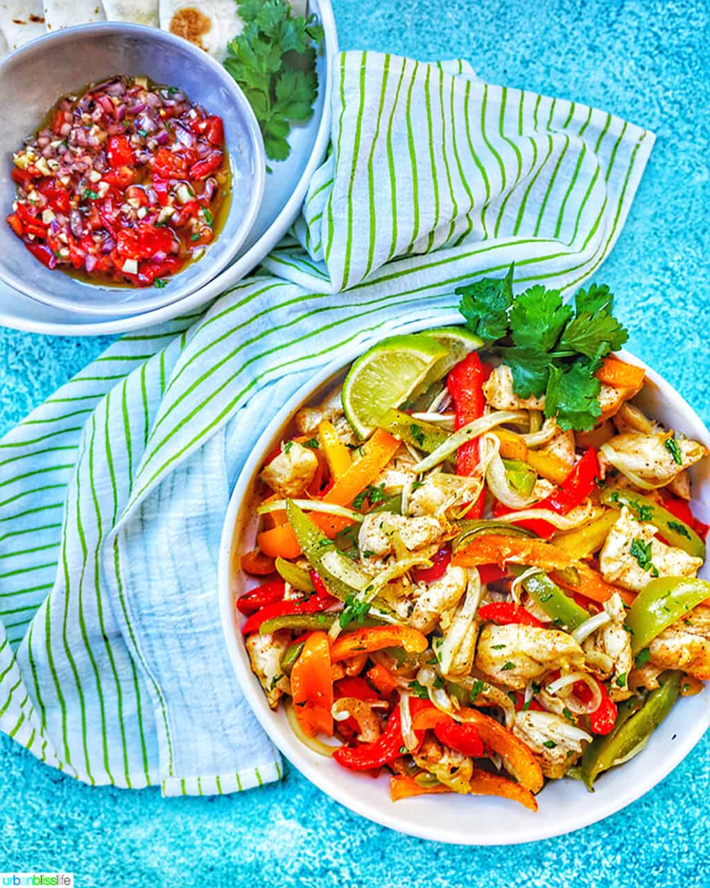 big bowl of Sheet Pan Chicken Fajitas and salsa